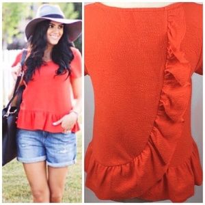 Anthropologie burn orange ruffle top